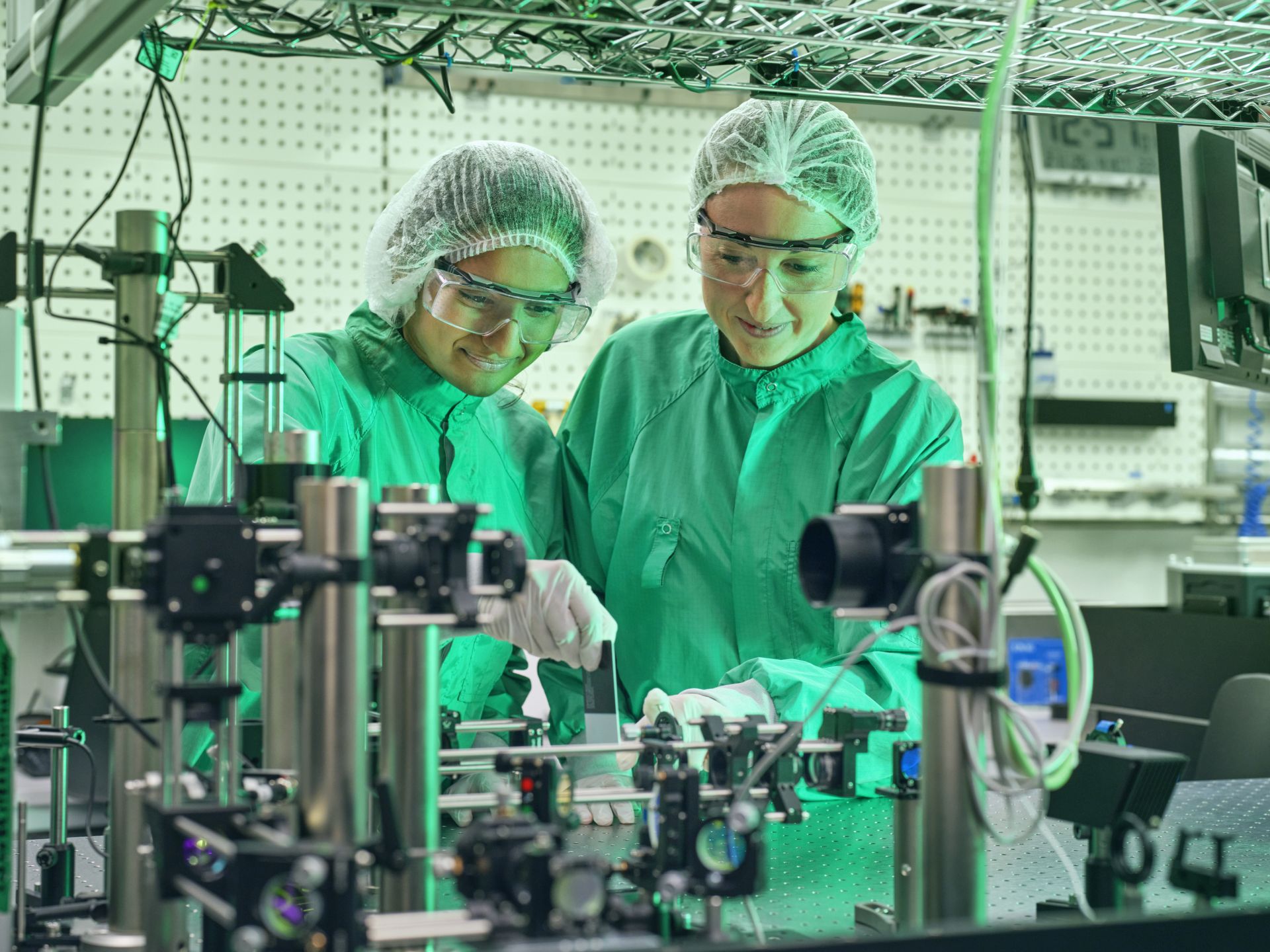 Researchers work on an optical setup in the laboratory.