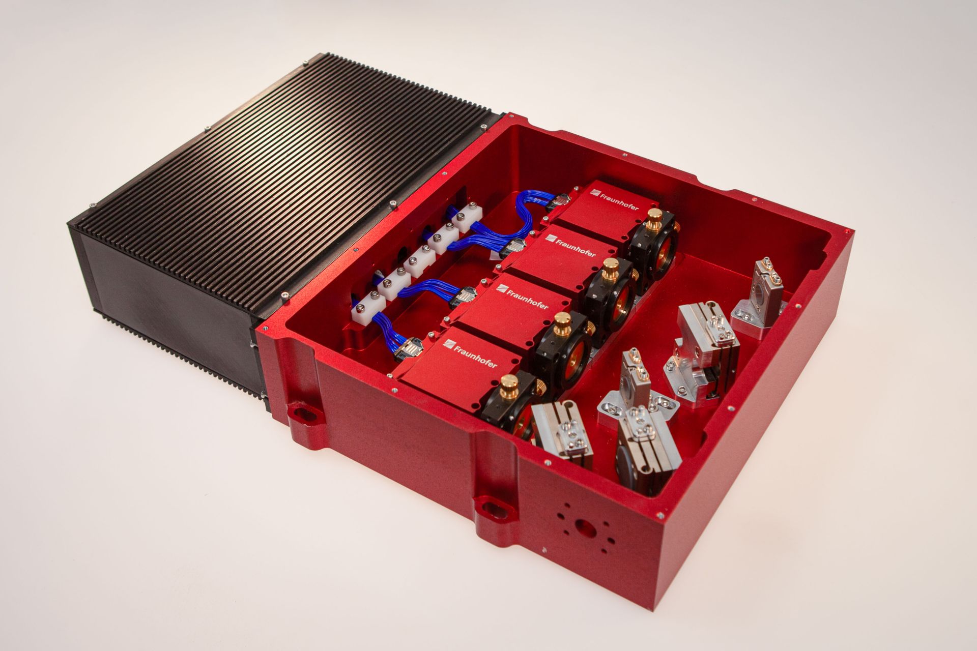 Open housing comprising four quantum cascade laser modules and further components