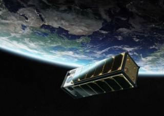 Nanosatellite "W-Cube" in space, in the background you can see the earth.
